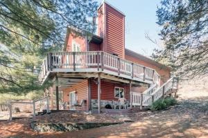 a large wooden house with a balcony on it at Cozy House in Quiet place. in Wisconsin Dells