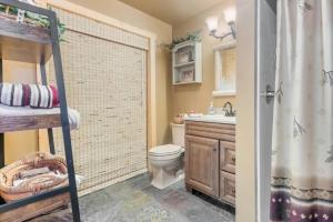 a bathroom with a shower and a toilet and a sink at Cozy House in Quiet place. in Wisconsin Dells +20 photos