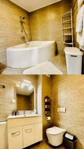 ein Badezimmer mit einem weißen Waschbecken und einem WC in der Unterkunft Sky is the limit in Sinaia