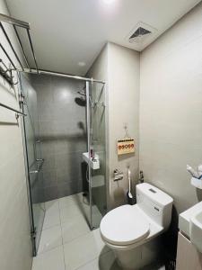 a bathroom with a toilet and a shower at Yên House in Ha Long