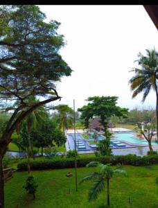 a view of a swimming pool in a resort at Owen Studio in Diani Beach