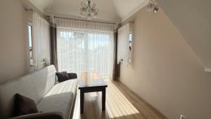 Ένα ή περισσότερα κρεβάτια σε δωμάτιο στο Willa Zieloneczka