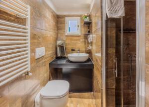 a bathroom with a toilet and a sink at Luxury Apartament Florence in Florence +65 photos