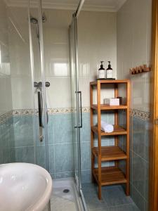 a bathroom with a shower and a sink at Pinares de Boo in Boó de Piélagos +23 photos