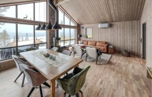 a living room with a table and chairs at Pet Friendly Home In Gl With Kitchen in Gålå