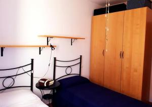 En eller flere senge i et værelse på Rilassarsi a Orosei