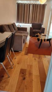 a living room with a couch and a table at 2 bed Solihull near NEC Airport, JLR, Resort Wrld in Solihull