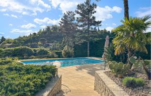 a swimming pool in the middle of a yard at 3 Bedroom Awesome Home In Puy-saint-martin in Puy-Saint-Martin