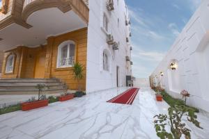 a large building with a red carpet on the floor at Golden House - جولدن هاوس التجمع الخامس in Cairo
