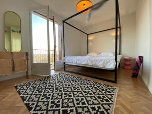 a bedroom with a bed with a large mirror at Chateau de la Biste in Tourdun