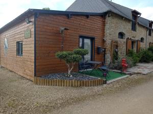 a small house with a tree in front of it at La villa Saint-Martin in Pontorson
