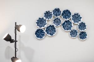 a group of blue and white plates on a wall at GuestReady - Miragaia Historical Sight in Porto