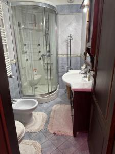 a bathroom with a shower and a toilet and a sink at Casa d amare in Gioiosa Marea +31 photos