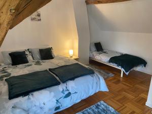 Postel nebo postele na pokoji v ubytování Les Vieux Chênes