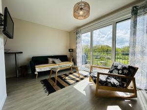Posedenie v ubytovaní Appartement vue mer, terrasse parking et plage