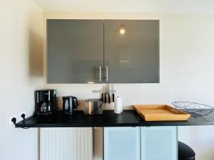 Virtuvė arba virtuvėlė apgyvendinimo įstaigoje Appartement plage des sables blancs