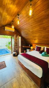 Postel nebo postele na pokoji v ubytování Palmyra Nature Resort Sigiriya