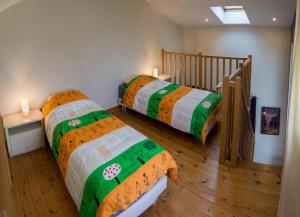 a bedroom with two beds and a staircase at 3 bedrooms, very quiet, fully equiped, between Bordeaux and Saint-Emilion in Vayres +2 photos