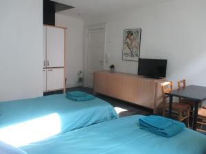 Postel nebo postele na pokoji v ubytování Guest House Feliz