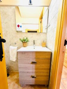 a bathroom with a sink and a mirror at LA PORTADA DE ABAJO in Gallegos +51 photos