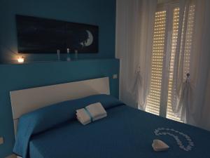Postel nebo postele na pokoji v ubytování SUN & MOON B&B