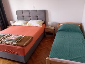 Postel nebo postele na pokoji v ubytování Apartments Silvija