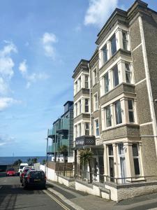 a tall building on the side of a street at Reef Lodge in Newquay