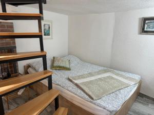 a small bedroom with a bed in a room at Apartment Tena in Senj