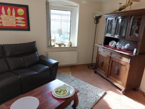 a living room with a couch and a table at Fewo Frieda in Seehausen