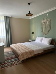 a bedroom with a large bed in a room at Antik Apartments Marmaris in Marmaris