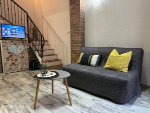 a living room with a couch and a table at Apartment Tena in Senj
