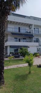 a large building with balconies on the side of it at Helen Apartments in Crikvenica