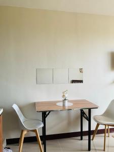 a table and two chairs in a room at Condo near Airport in Lapu Lapu City
