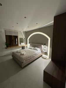 Postel nebo postele na pokoji v ubytování Incanto Luxury Suites + 4 fotografie