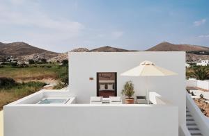 a white house with a view of the desert at Parilio, a Member of Design Hotels in Naousa