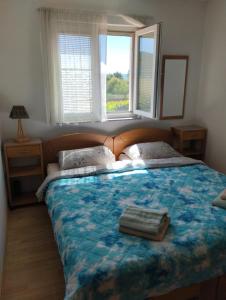 Ένα ή περισσότερα κρεβάτια σε δωμάτιο στο Apartman Peace