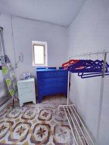 a room with a blue bunk bed and a blue dresser at Traditional Maltese Townhouse in Rabat in Rabat