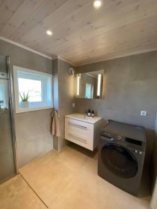 Ванна кімната в Borestranda - Nytt strandhus med 6 sengeplasser!
