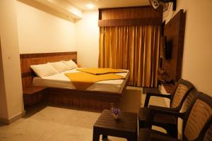 Tempat tidur dalam kamar di Shree Mantra Homestay