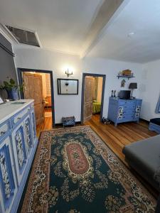 a living room with a couch and a rug at LINO'S HOUSE in Sori