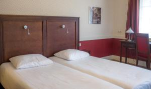 Ένα ή περισσότερα κρεβάτια σε δωμάτιο στο Hotel Konbanwa