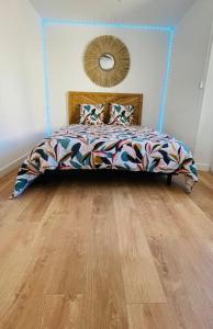 a bedroom with a bed and a wooden floor at Jungle (Play) Room in Le Muy