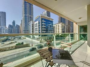 a balcony with a view of a city skyline at Key View - Marina Park in Dubai