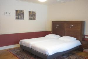 Postel nebo postele na pokoji v ubytování Hotel Boshof + 5 fotografií
