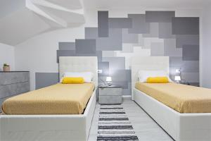 Postel nebo postele na pokoji v ubytování Villino Serena