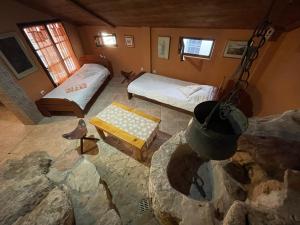 an overhead view of a room with two beds at Cave Apartment in Virpazar