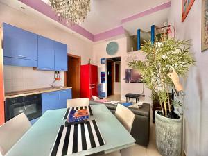 a kitchen with a table and a dining room at CIAOBRO Apartment in Modugno