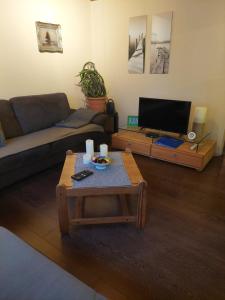 a living room with a couch and a coffee table at Ferienwohnung in Malente