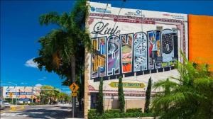 a building with a mural on the side of it at Stylish 2 Bedroom Apartment In The Heart Of Miami in Miami
