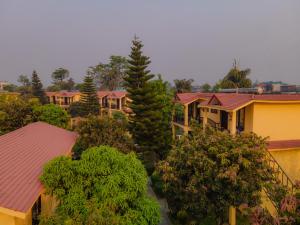 an overhead view of houses with trees and roofs at Hotel Seven Star in Sauraha